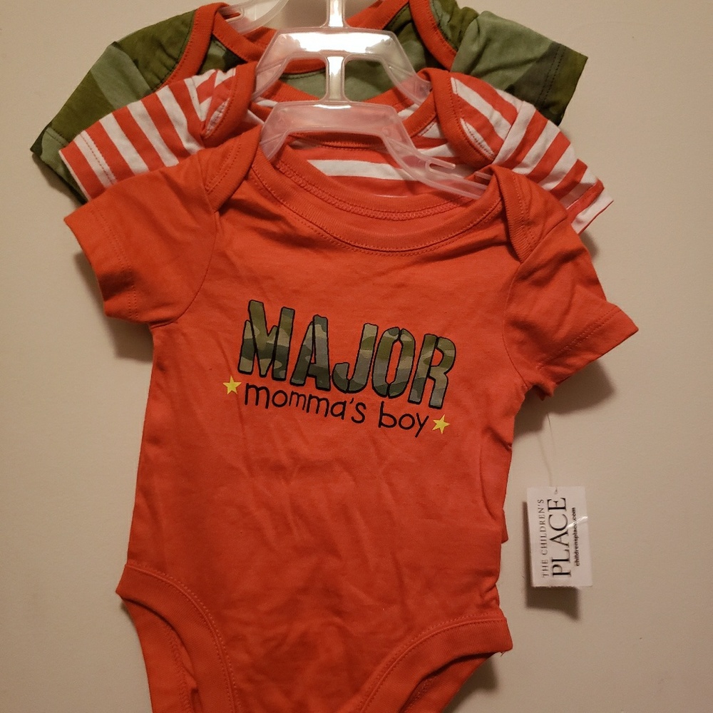 A 3 piece set of never worn with tags onesies